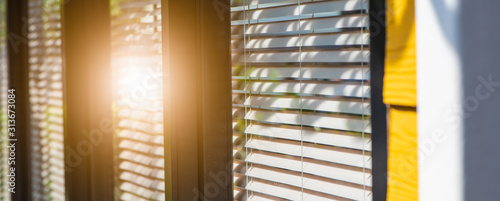 Venetian blind window mask, room interior with sunflare, blinds window decoration concept for banner or background.