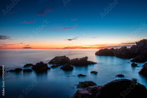 Beautiful sunset over the sea and rocks