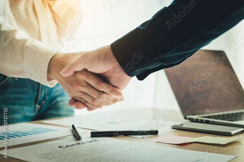 handshake business partners agree to contract Real Estate Venture International trade,contract investment in meetings vision to invest for profit.