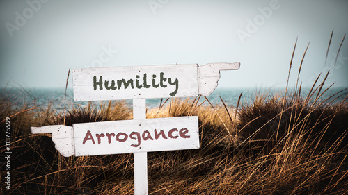 Street Sign to Humility versus Arrogance