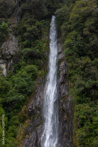 Thunder Creek Falls. Haast Makarora Pass Highway. South Island New Zealand. River and rocks
