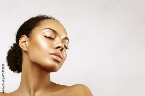 African American skincare models portrait. Beauty spa treatment concept.Young girl posing with closed eyes against grey background