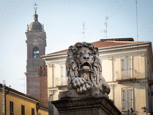 Statue of one of the two Lions placed on the pylons of the "Ponte dei Leoni", in the city center of Monza (Italy)