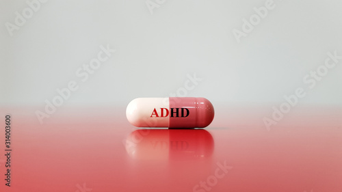 Medication capsule for treatment ADHD(Attention deficit hyperactivity disorder)on red white background. This is mental disorder of neural development cause behavior problem. Medical technology concept