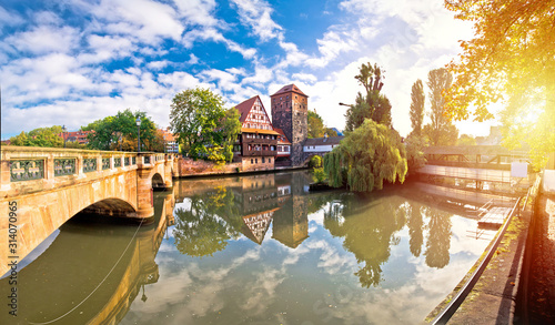 Nurnberg. Pegnitz river weaterfront Weinstadel and Henkersteg in Nuremberg sunrise view