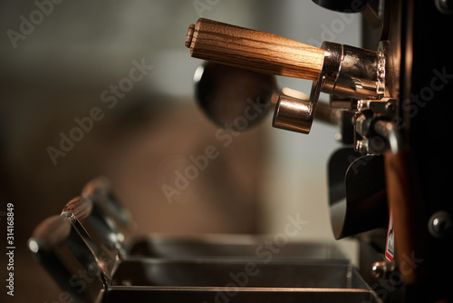 Details of coffee roasting equipment. Close-up.