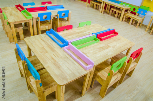 Desks and chairs in the kindergarten classroom.