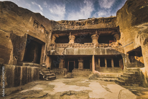 ELLORA, INDIA, DECEMBER 5 2016: Ellora caves in central India, a Unesco heritage site consisting of pilgrimage caves carved in solid rock during sunny weather in december.