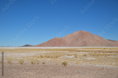 Mountain peak with a perfect blue sky background, located in the arid level plain of Puna highlands, Argentina