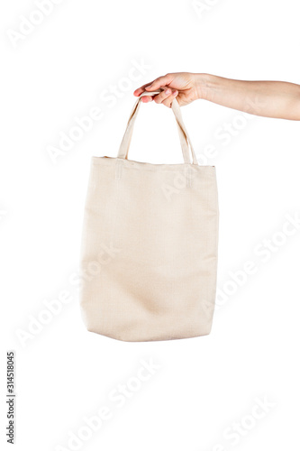 Woman with cotton eco bag over white backgound. Ecology or environment protection concept. White eco bag for mock up
