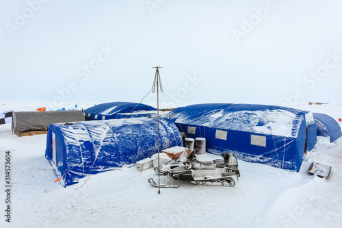Arctic background. Base polar explorers. Camping tents of expedition to the North pole. Development Of The Arctic. Special equipment for life support in extreme polar conditions.