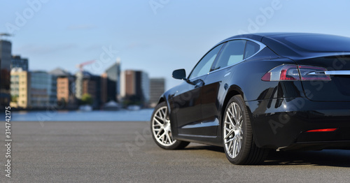 Electric business car parked on city embankment