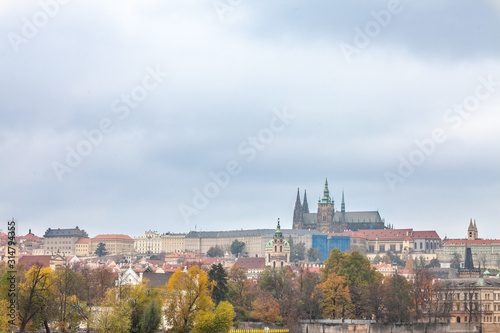 Panorama of the Old Town of Prague, Czech Republic, in autumn, at fall, with Hradcany hill and the Prague Castle with the St Vitus Cathedral (Prazsky hill) seen from Vltava river.