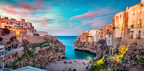 Spectacular spring cityscape of Polignano a Mare town, Puglia region, Italy, Europe. Colorful evening seascape of Adriatic sea. Traveling concept background..