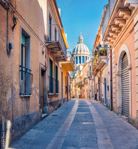 Bright spring cityscape of Ragusa town with Duomo San Giorgio - baroque Catholic church on background. Nice morning scene of Sicily, Italy, Europe. Traveling concept background.