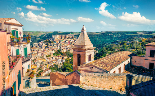 Sunny spring cityscape of Ragusa town with Church of St Mary of the Stairs on background. Wonderfulmorning scene of Sicily, Italy, Europe. Traveling concept background.