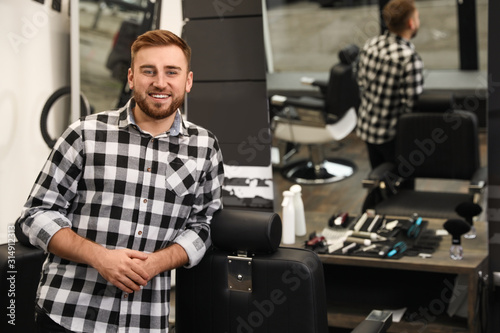 Young business owner in his barber shop