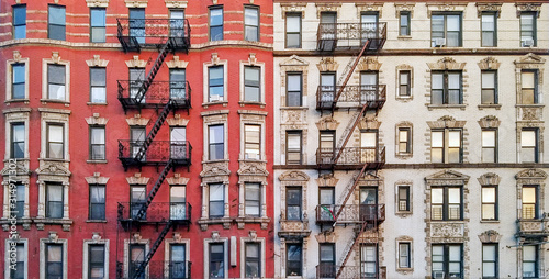 New York City historic apartment building panoramic view with windows and fire escapes