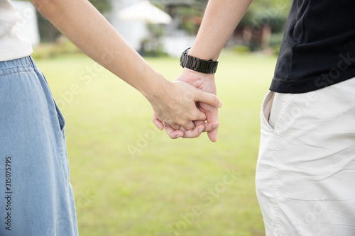 background of couple holding hand