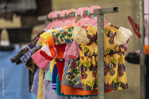 Vintage clothes hanging on clothes hanger on a rail