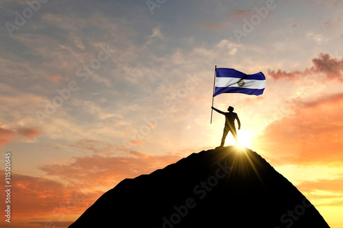 El Salvador flag being waved at the top of a mountain summit. 3D Rendering