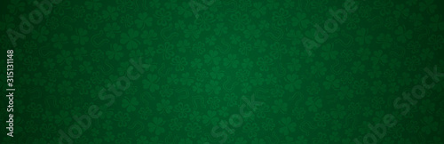 Green Patricks Day greeting banner with green clovers. Patrick's Day holiday design. Horizontal background, headers, posters, cards, website.Vector illustration