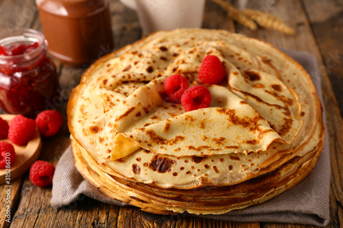 stack of crepe with raspberry and chocolate