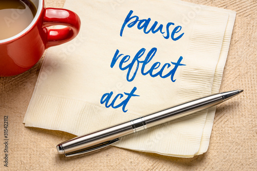 pause, reflect, act concept - words on napkin