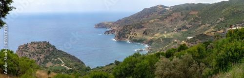 Sea bay area with mountain landscape used as banana farming soil. Panorama in high resolution.