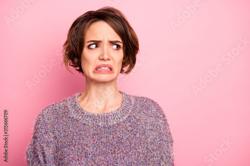 Close-up portrait of her she nice attractive lovely pretty brown-haired girl unpleasant look reaction grimacing isolated over pink pastel color background