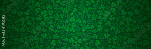 Green Patricks Day greeting banner with green clovers. Patrick's Day holiday design. Horizontal background, headers, posters, cards, website. Vector illustration