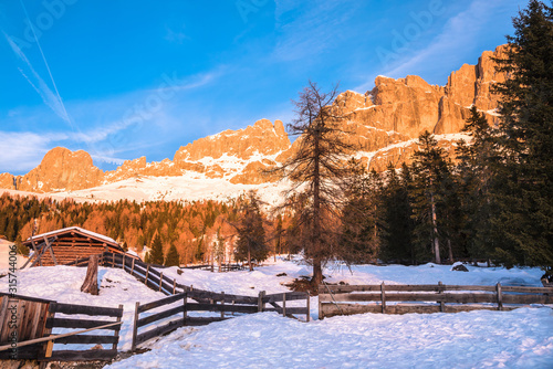 Snowy mountain landscape in the Dolomites at sunset