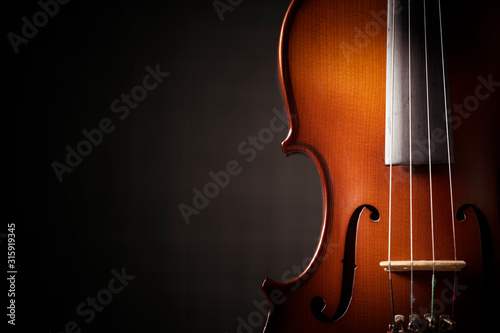 Beautiful antique violin on black background