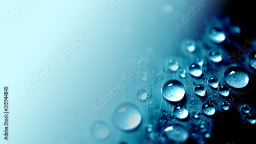 vivid blue water drop texture background for cold , freshness and drinking concept