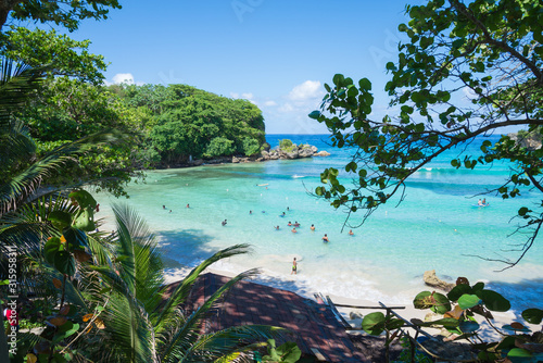 Shore of Winnifred Beach, Jamaica. Turquoise waters, little waves and ripples.