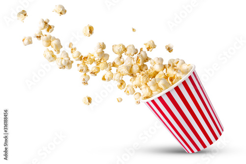 Popcorn viewed float Paper cup with popcorn on white isolated .