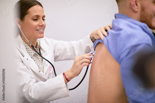 Young guy having his lungs examined