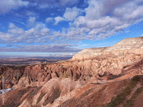 Colorful tufa formations on Red Valley (Kizilcukur Valley) at sunset in Cappadocia, Turkey