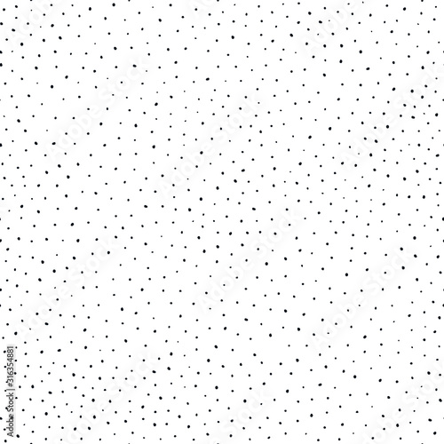 Background polka dot. Seamless pattern. Random dots, snowflakes, circles. Design for fabric, wallpaper. Irregular chaotic abstract texture with messy dots tiled. Repeating hand drawn chaotic dots