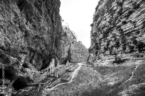 Fara San Martino, Majella National Park, Chieti, Abruzzo, Italy, Europe. Black and white photo of the remains of the old Benedictine abbey in the Gorges of Fara San Martino