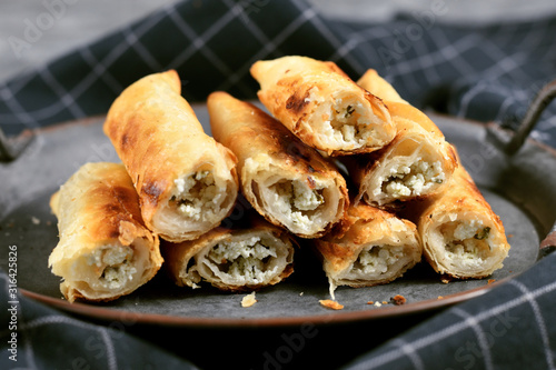 Fresh baked 'Börek', a baked filled pastries made of a thin flaky dough filled with sheep milk cheese from treditional Balkan cuisine