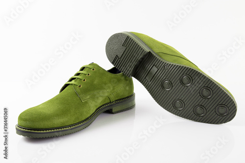 Male green leather shoes on white background, isolated product.