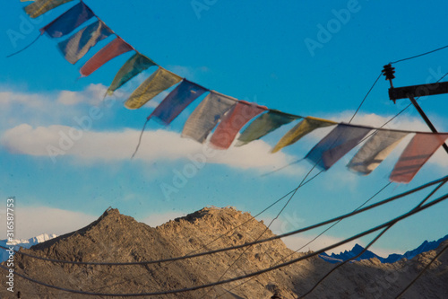 Tibetan flags waving in the wind in Leh, Ladakh