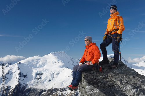 Mountain climbers on mountain peak