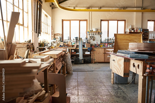 Interior of a large bright woodworking workshop