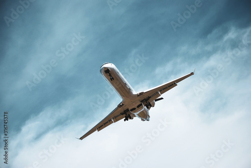 Epic shot of a landing CRJ series regional aircraft in short final