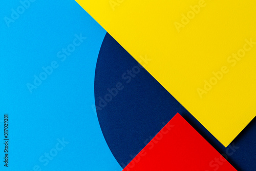 Abstract colored paper texture background. Minimal geometric shapes and lines in light blue, navy, red and yellow colours