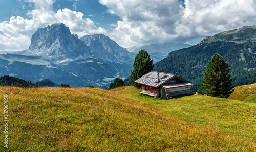 Wonderful landscape in Val Gardena on a sunny day. Scenic image of famous Sassolungo peak. Amazing nature background in dolomites Alps. Dolomiti, Trentino Alto Adige, Bolzano, Italy, Europe.