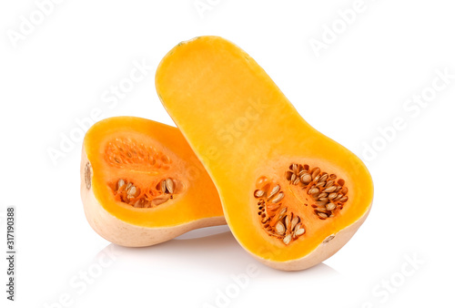 half butternut squash with seeds isolated on white background.