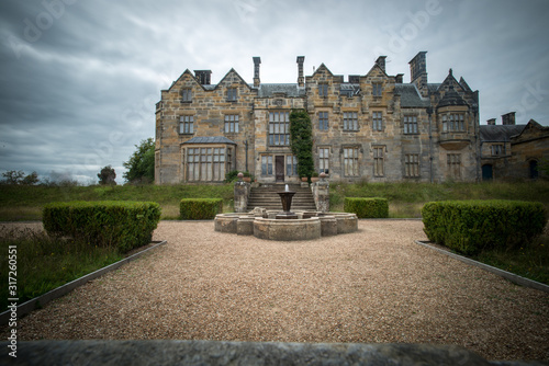 English mansion with a cloudy sky